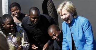 Hillary dances with local Africans in Cape Town 