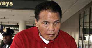 Boxing star Muhammad Ali visits a gym in Manchester