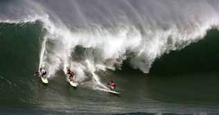 Surfers take on giant Hawaiian waves