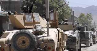 Taliban in suicide vests grasp building in Afghanistan