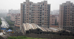 Building collapses in Shanghai as structure remains intact