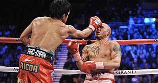 Filipino Boxing Icon Pacquiao wins over Puerto Ricos Cotto