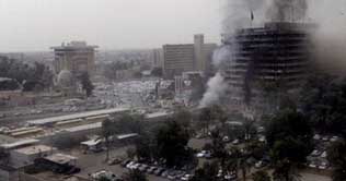 Baghdad car bombs near government offices kill 136