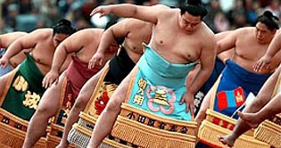 Sumo grand champion perform traditional New Years rite