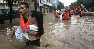 Heavy rains and flooding kill 15 in southern China