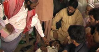 A fake Pir operates people with knife