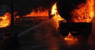 3 people killed, 17 NATO containers torched in Islamabad