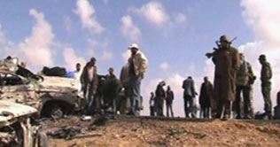  Libya: Protesters exchange fire with Gaddafi troops