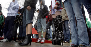 Men march in heels for awareness on violence against women
