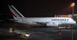 A jetliner clips tail of a smaller jet at New York's JFK airport