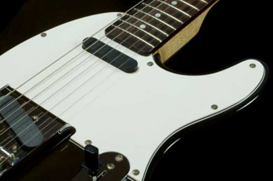 Graveyard worker steals guitar from casket