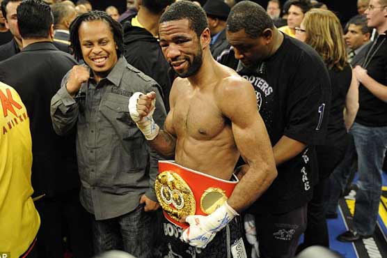 Peterson edges Khan to claim world titles