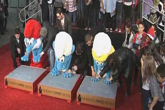 The Smurfs honoured with historic handprint ceremony 