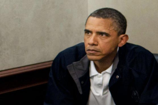 Obama drops opposition to Iran sanctions bill