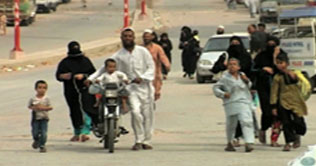 Starving residents of Qasba Colony flee