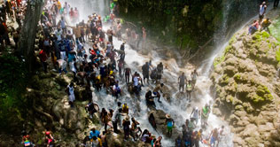Haitians travel to sacred waterfall in voodoo pilgrimage