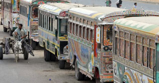 Commuters stuck on bus stops due to strike in Karachi 