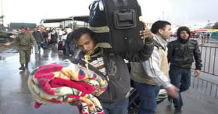 Hundreds of North African migrants arrive in Italian island