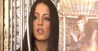 Salina promotes animal rights by caging herself