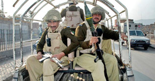 10 security personnel injured in road bombing