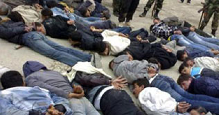 Syrian troops carry out mass arrests in Damascus suburb