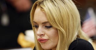 Lohan sentenced to 4 months in jail for theft 