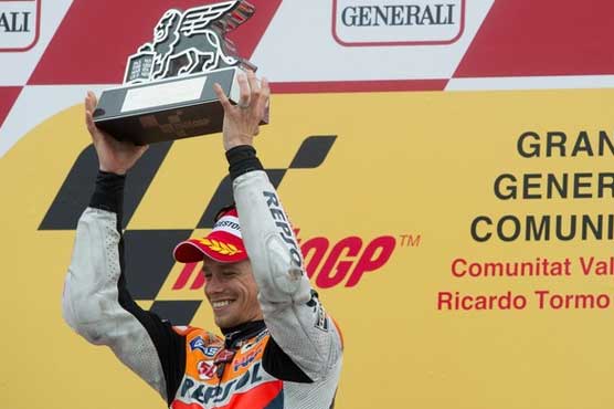 Stoner caps championship with win at Valencia title
