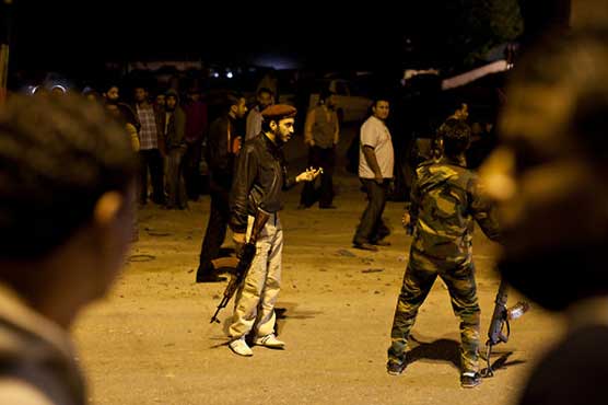 Rival Libyan militias clash near military base