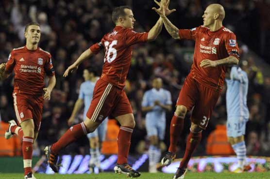 Liverpool holds leader Manchester City to 1-1 draw