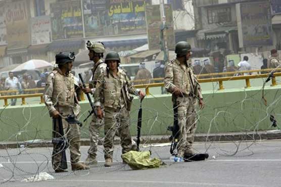 Baghdad: 14 killed in twin suicide attacks on police stations