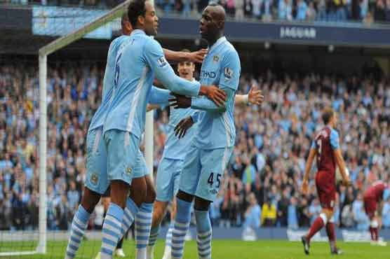 Man City goes top after United draws at Liverpool