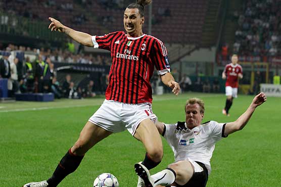 Milan beat Borisov to keep pace with Barca 