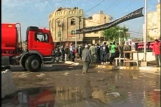 Officials: Twin bombs kill 18 in Baghdad