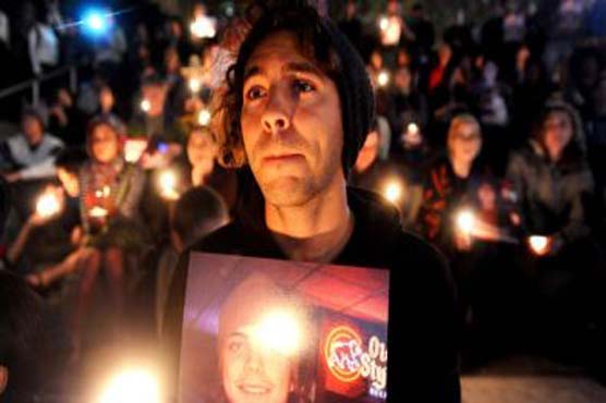 Wall Street protesters hold vigils for injured vet