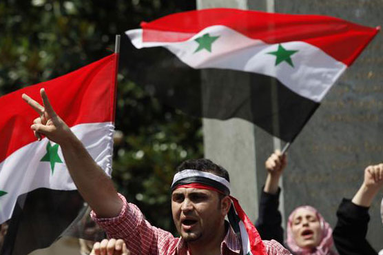 Syrian forces kill 14 civilians in Homs city