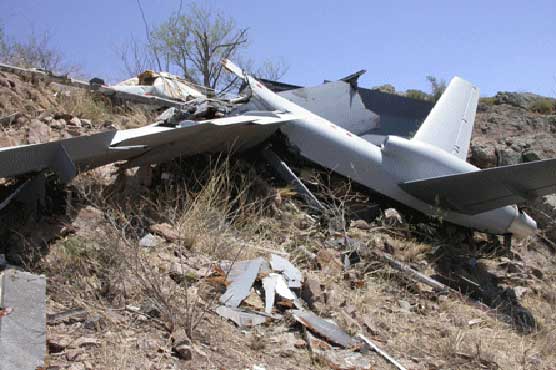 Pakistan troops battle Taliban for US drone debris
