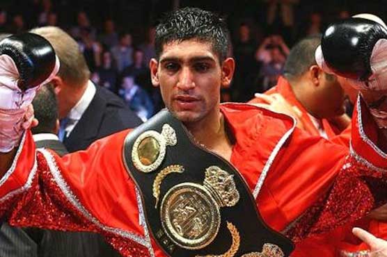 Boxing: Khan to defend title in Washington: report
