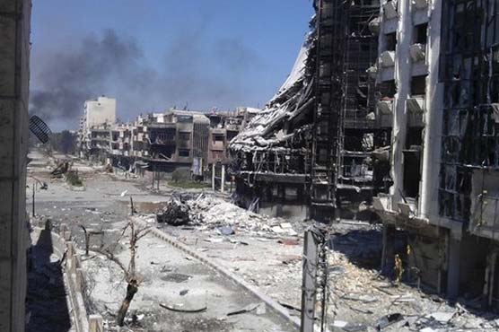 Syrian forces pound Homs despite ceasefire
