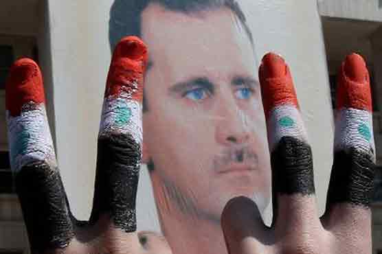 Assads supporters urge foreign powers not to interfere 