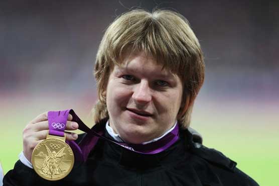 Ostapchuk beats Adams for Olympic shot put gold