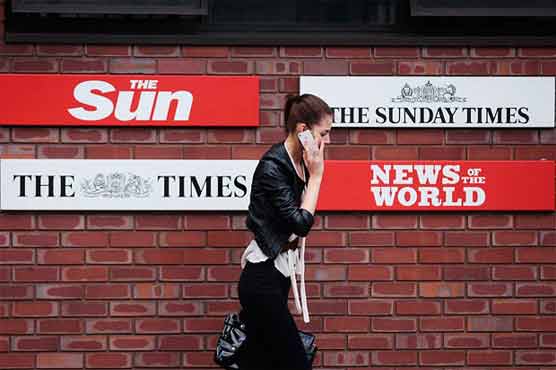 UK police arrest The Sun reporter over corruption 