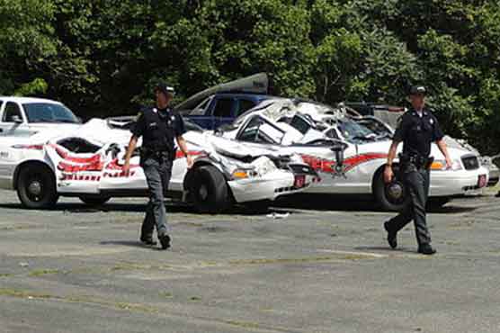 Man arrested after crushing police cruisers with tractor