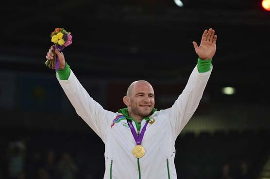 Taymazov of Uzbekistan wins 3rd straight Olympic