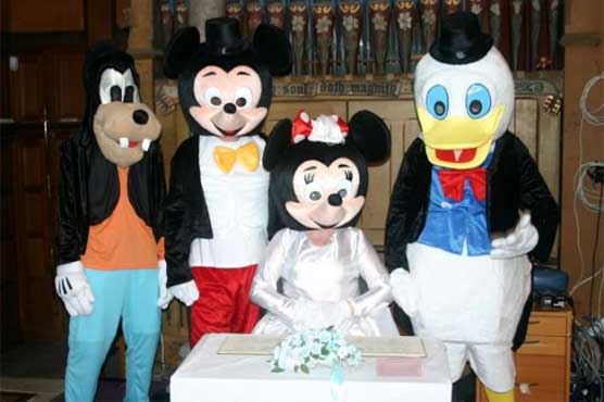 Couple renew wedding vows in unusual costumes