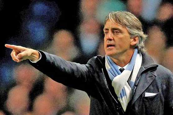 Football: City face battle to retain title, says Macini 