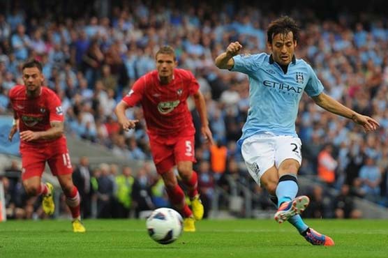 Man City recovers to open title defense with win