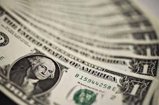 Dollar holds steady in Asia on economic data