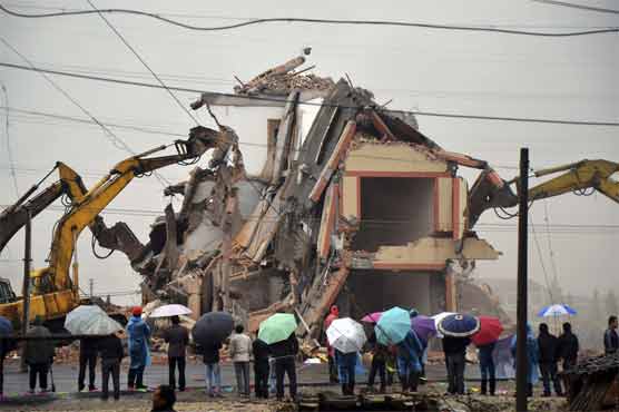  Lone Chinese home destroyed; farmer accepts deal