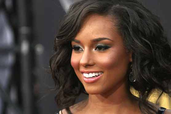 Alicia Keys raises $1.3M at gala, honors Winfrey 