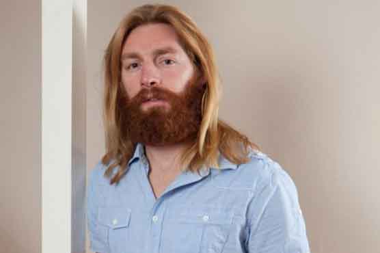 Fan kicked out of darts final for looking like Jesus